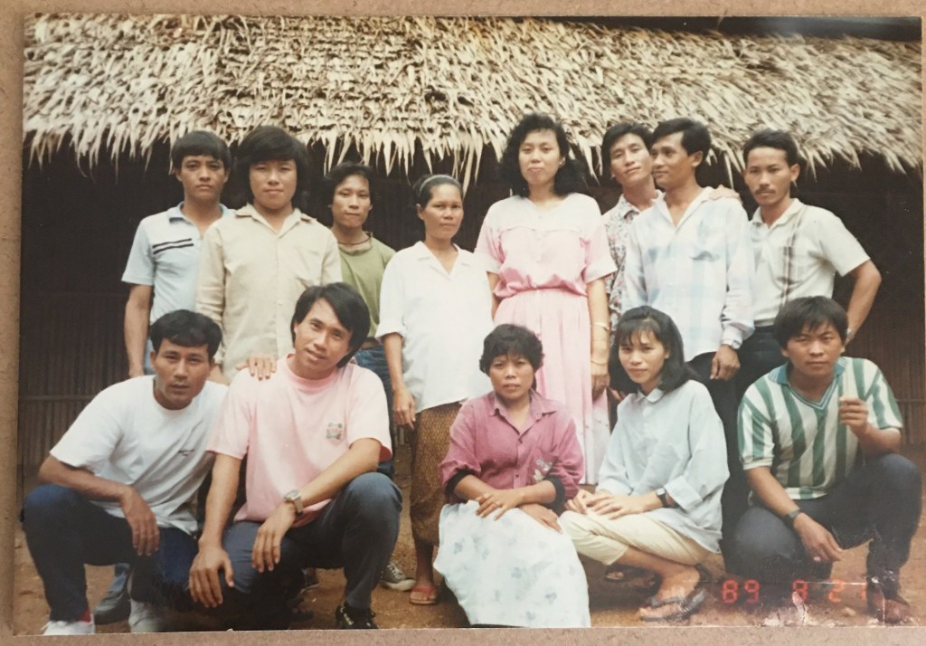 Mom, fourth from the left in the back row, in a refugee camp in Thailand
